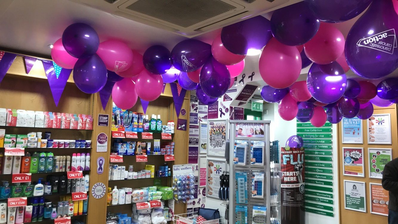 Purple Pancreatic Cancer Action balloons and decorations in Knights Oakwood Pharmacy for Pancreatic Cancer Action's Turn it Purple campaign