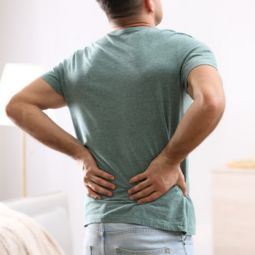 Mid-back pain or discomfort can be a symptom of pancreatic cancer.